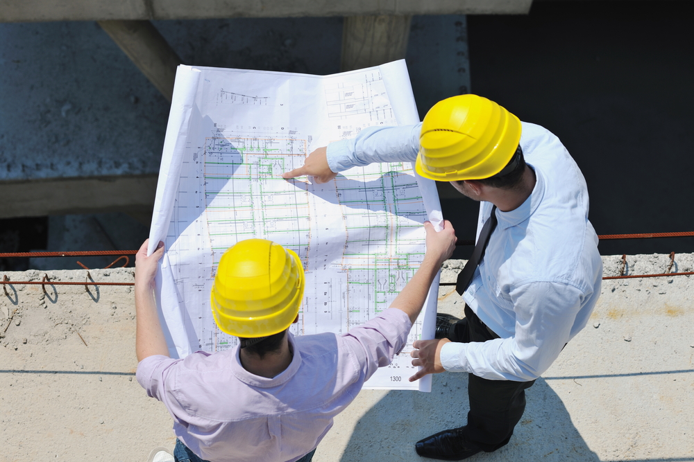 Construction Managers Reviewing Architect Plans