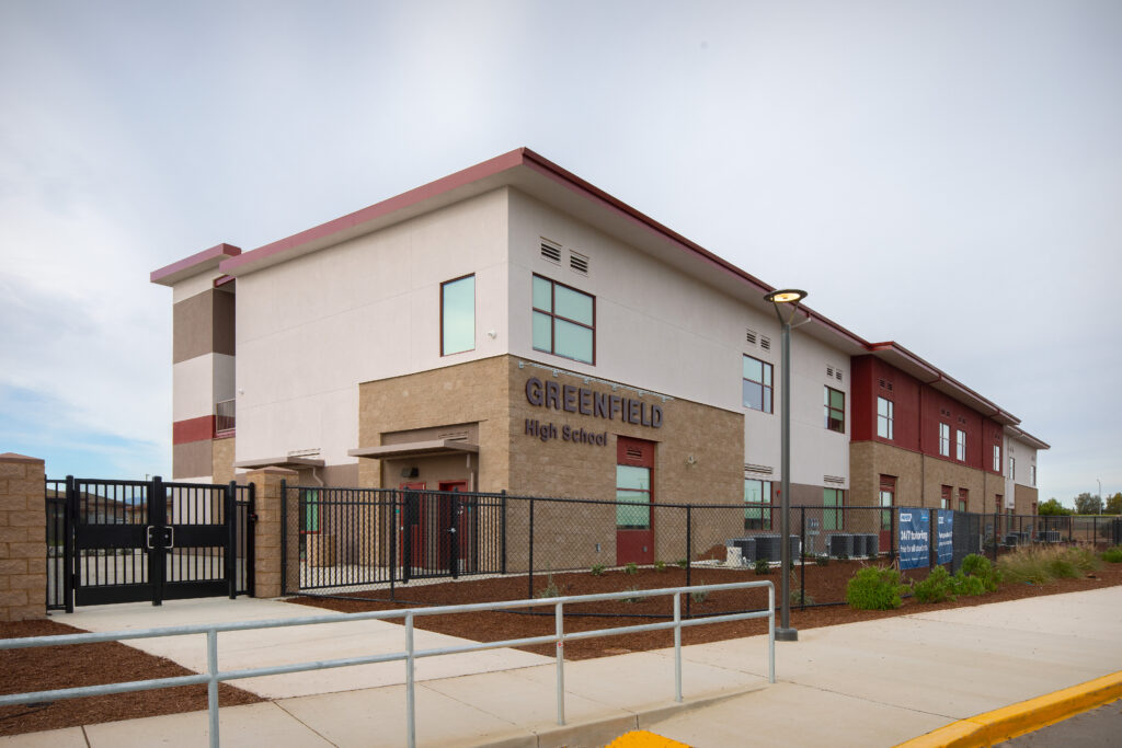 Main entrance to the Greenfield High School modular classroom building, featuring signage and a secure perimeter.