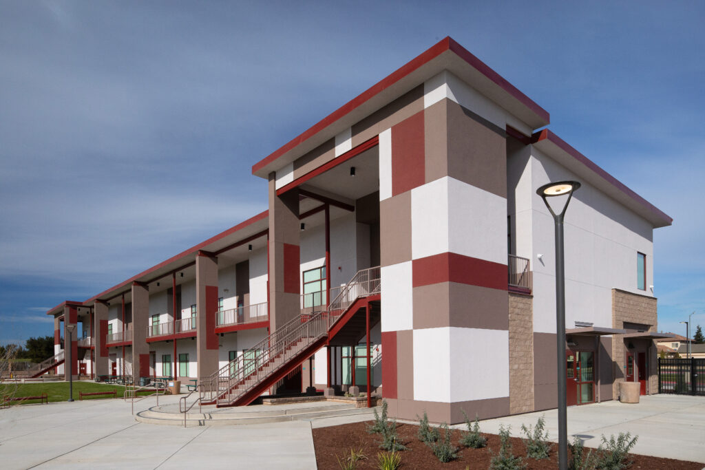 A bright day view of the Greenfield High School modular classroom building, highlighting its modern architecture and spacious design.