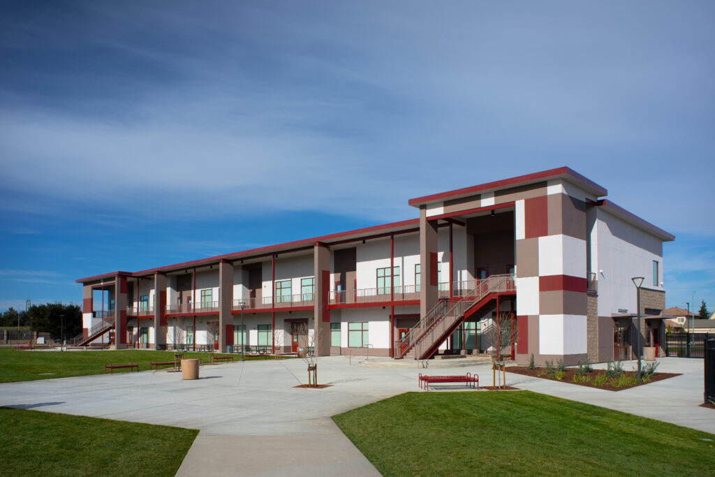 Exterior view of the Greenfield High School modular building, emphasizing the two-story design and modern amenities.