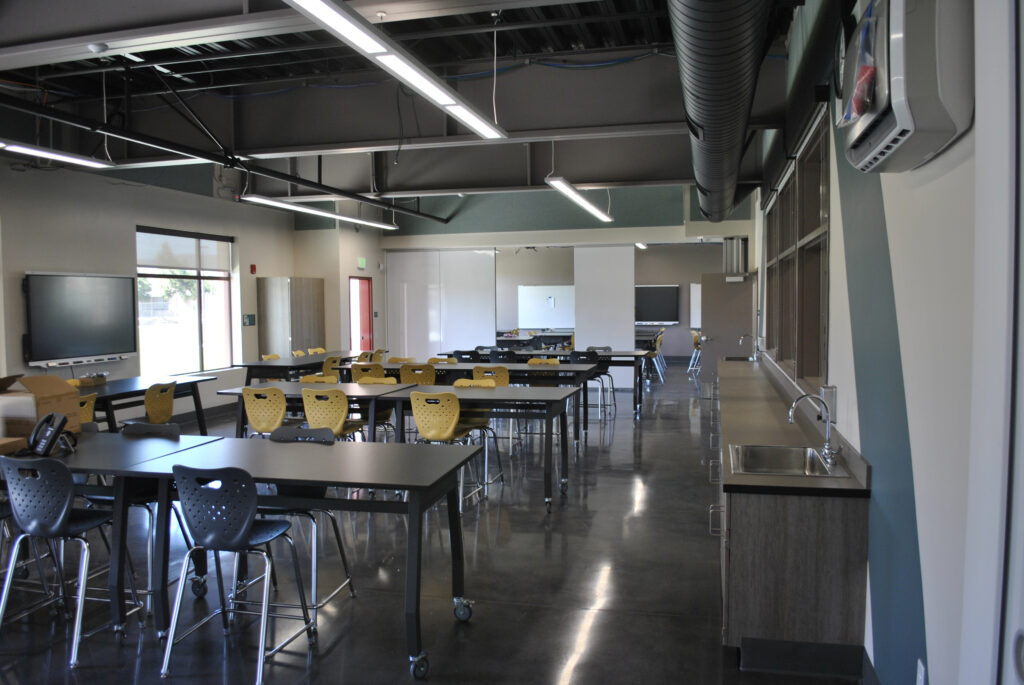 Interior of a STEM classroom at Greenfield High School, showing modern seating, workstations, and open space for learning.