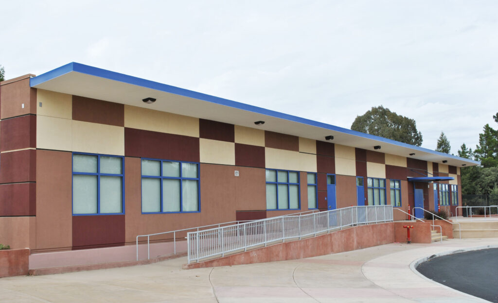 Side view of Alhambra High School's new modular school building with an accessible ramp.