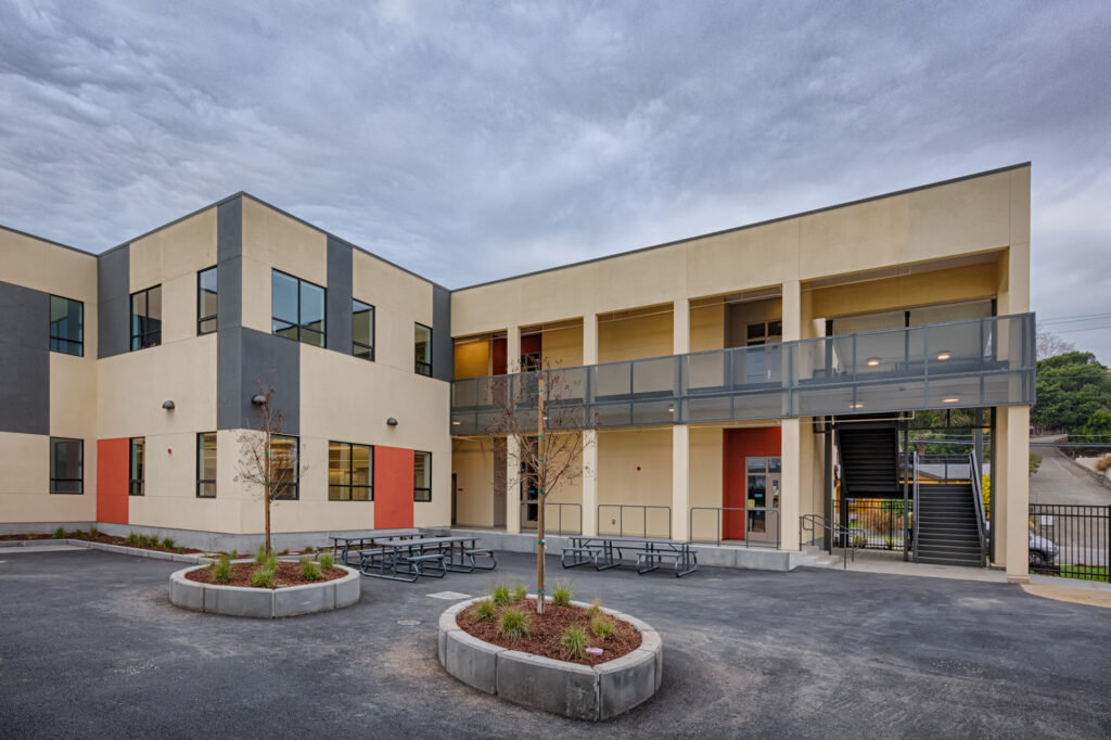 Side view of the Davidson Middle School science building, featuring exterior stairs and open walkways.