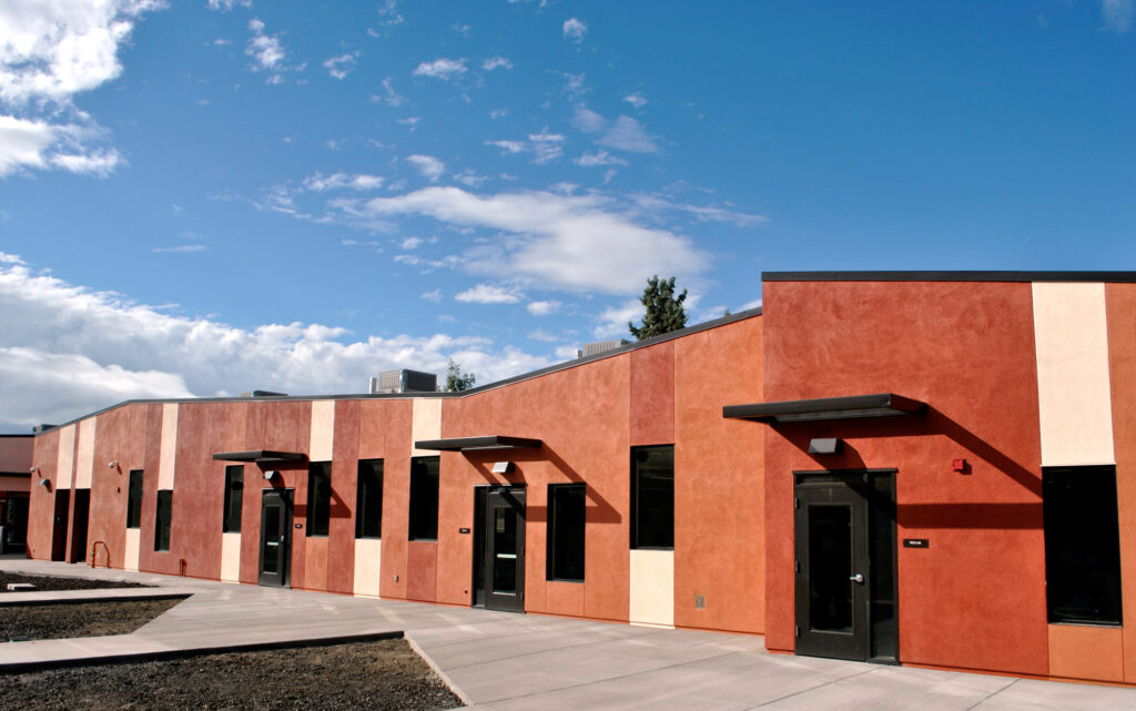 Rear view of the Milpitas Education Center, highlighting classroom wings and sustainable design.
