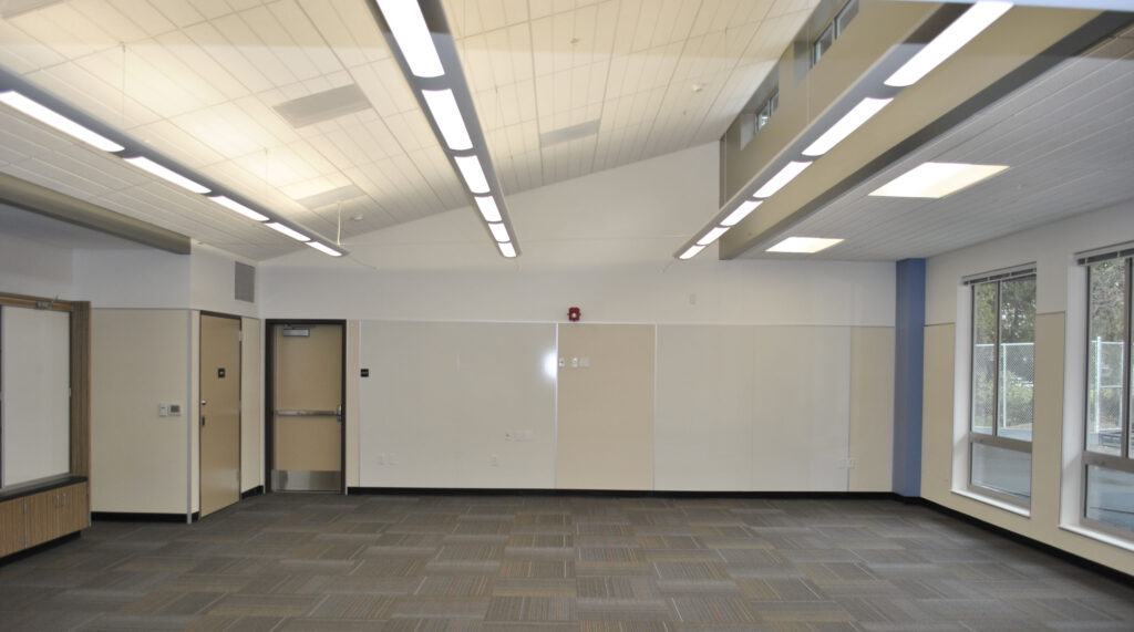 Interior of a modern kindergarten classroom at Lucerne Elementary School, designed with natural lighting and dedicated workspaces.