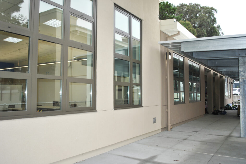 Roosevelt Elementary School modular classroom exterior with large windows and a connected covered walkway.