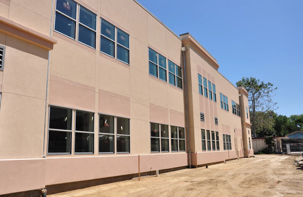 Side view of the Soquel Elementary School modular classroom building, highlighting the large windows and expansive two-story layout.