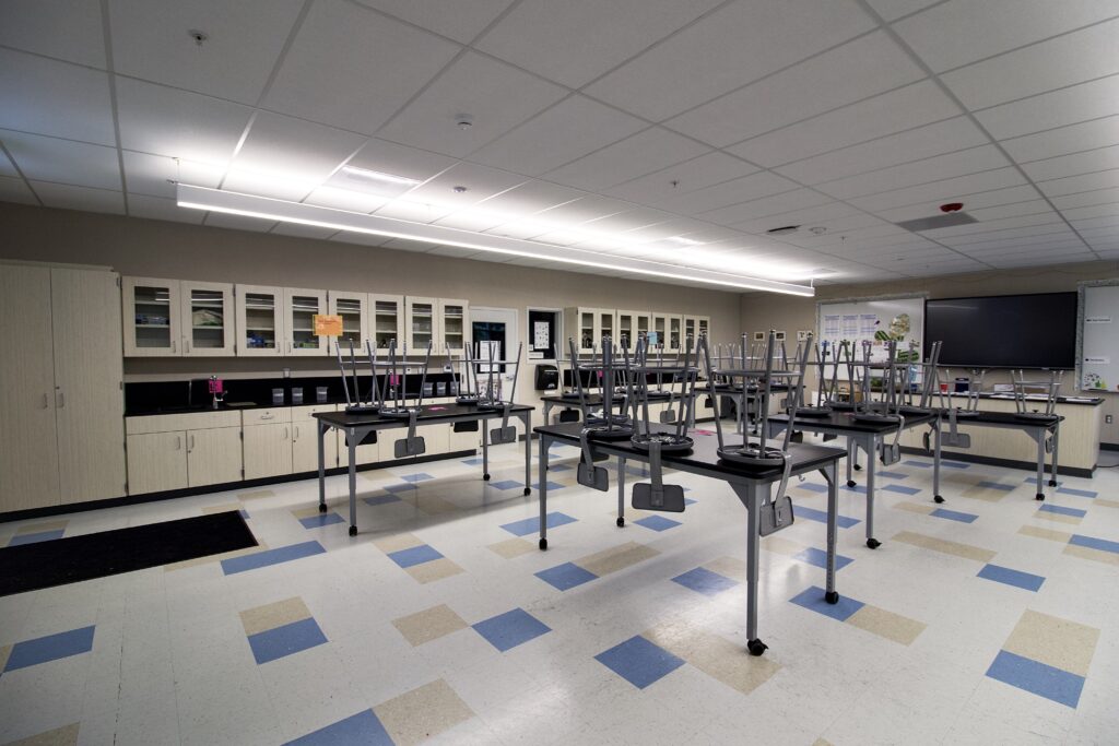 Interior of a science classroom at Hart Middle School, featuring specialized lab tables, sinks, and storage cabinets.