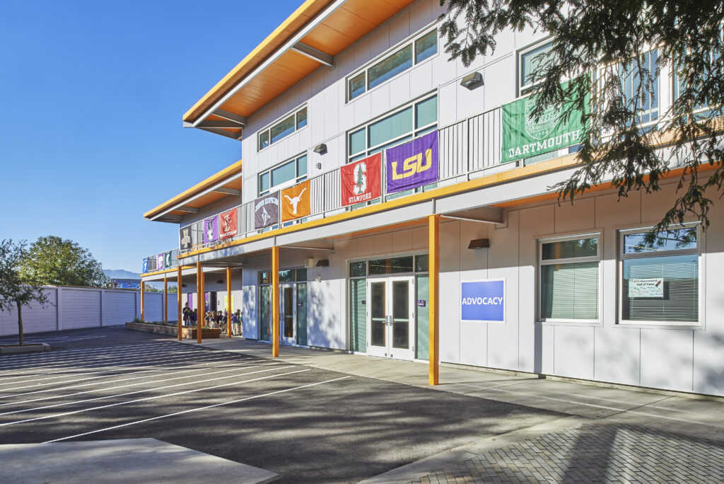 Advocacy office and courtyard at Rocketship Senter Road Campus with educational banners and student pathways.
