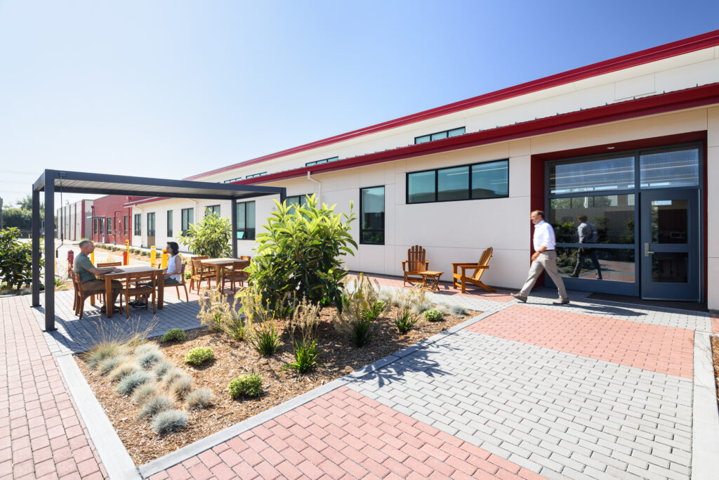 A modern modular administrative facility featuring external walkways and integrated campus spaces.