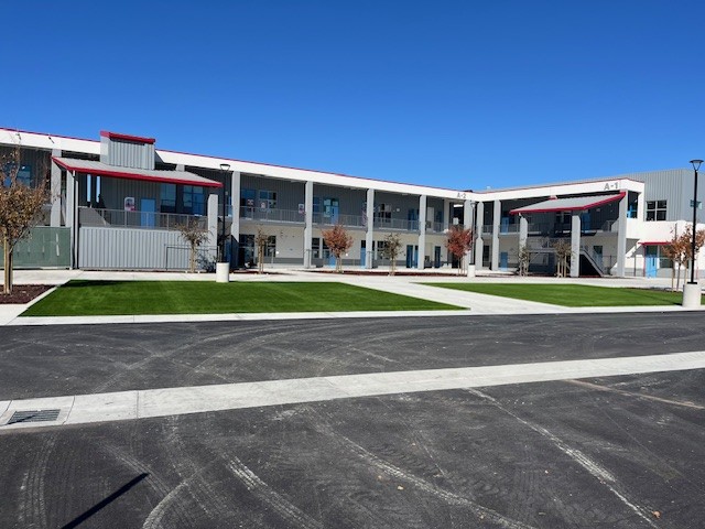 The North Salinas High School construction project courtyard, showing new landscaping and the L-shaped classroom facility.